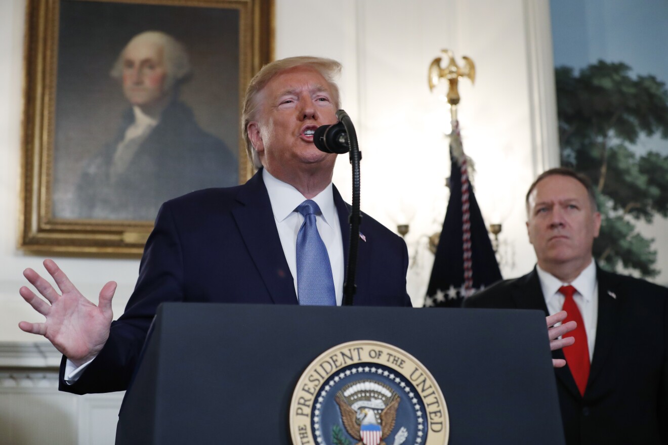 President Donald Trump, accompanied by Secretary of State Mike Pompeo, speaks Wednesday, Oct. 23, 2019, in the Diplomatic Room of the White House in Washington.